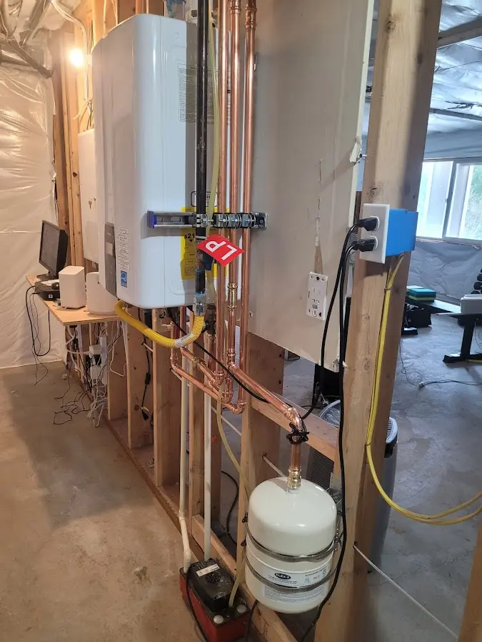 Licensed plumber repairing a kitchen sink in Deep River